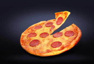Image of Hot tasty pepperoni pizza on dark background. Image for menu or poster