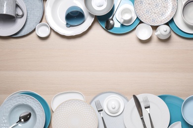 Photo of Flat lay composition with beautiful dishware on wooden table. Space for text