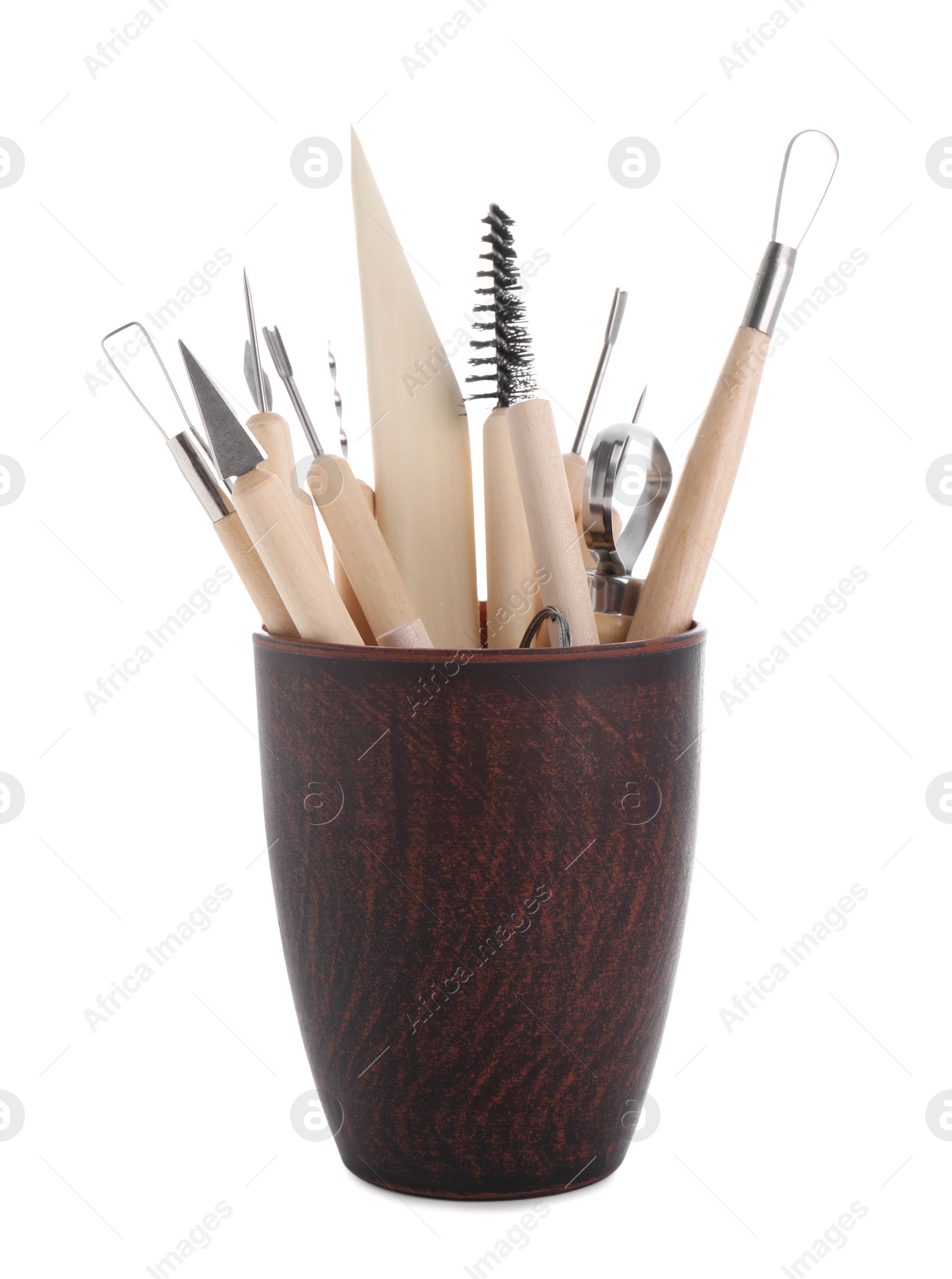 Photo of Set of different clay crafting tools in holder isolated on white