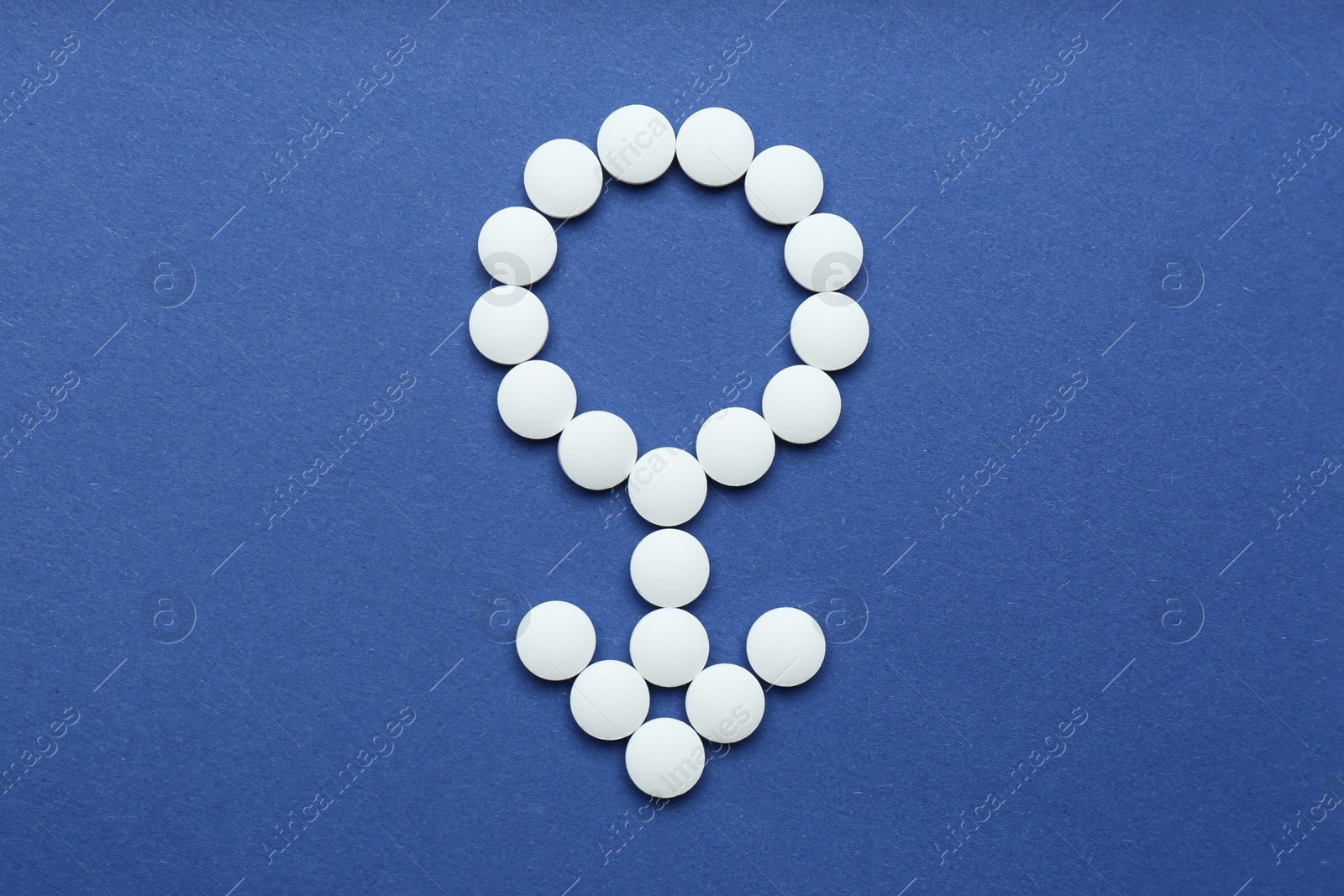 Photo of Male sign made of white pills on blue background, flat lay. Potency problems