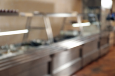 Blurred view of serving line with food in school canteen