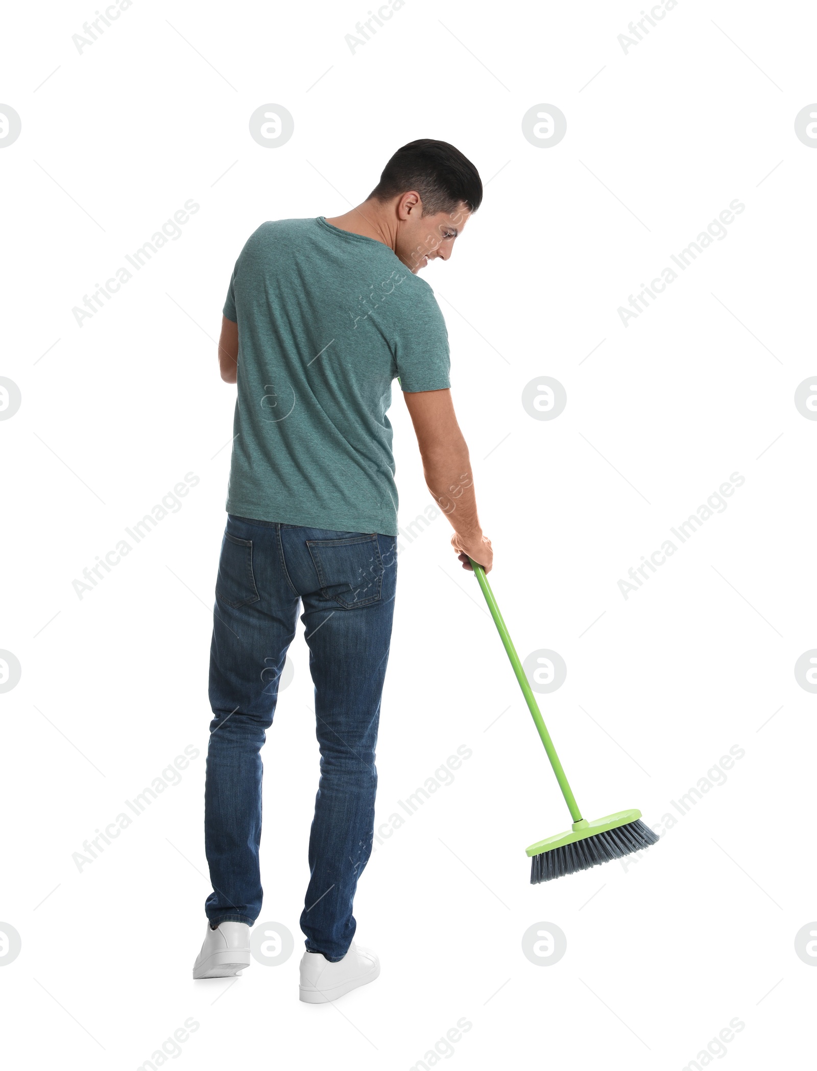 Photo of Man with green broom on white background