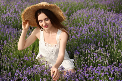 Young woman in lavender field on summer day