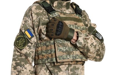Photo of Soldier with Ukrainian flag and trident on military uniform against white background, closeup