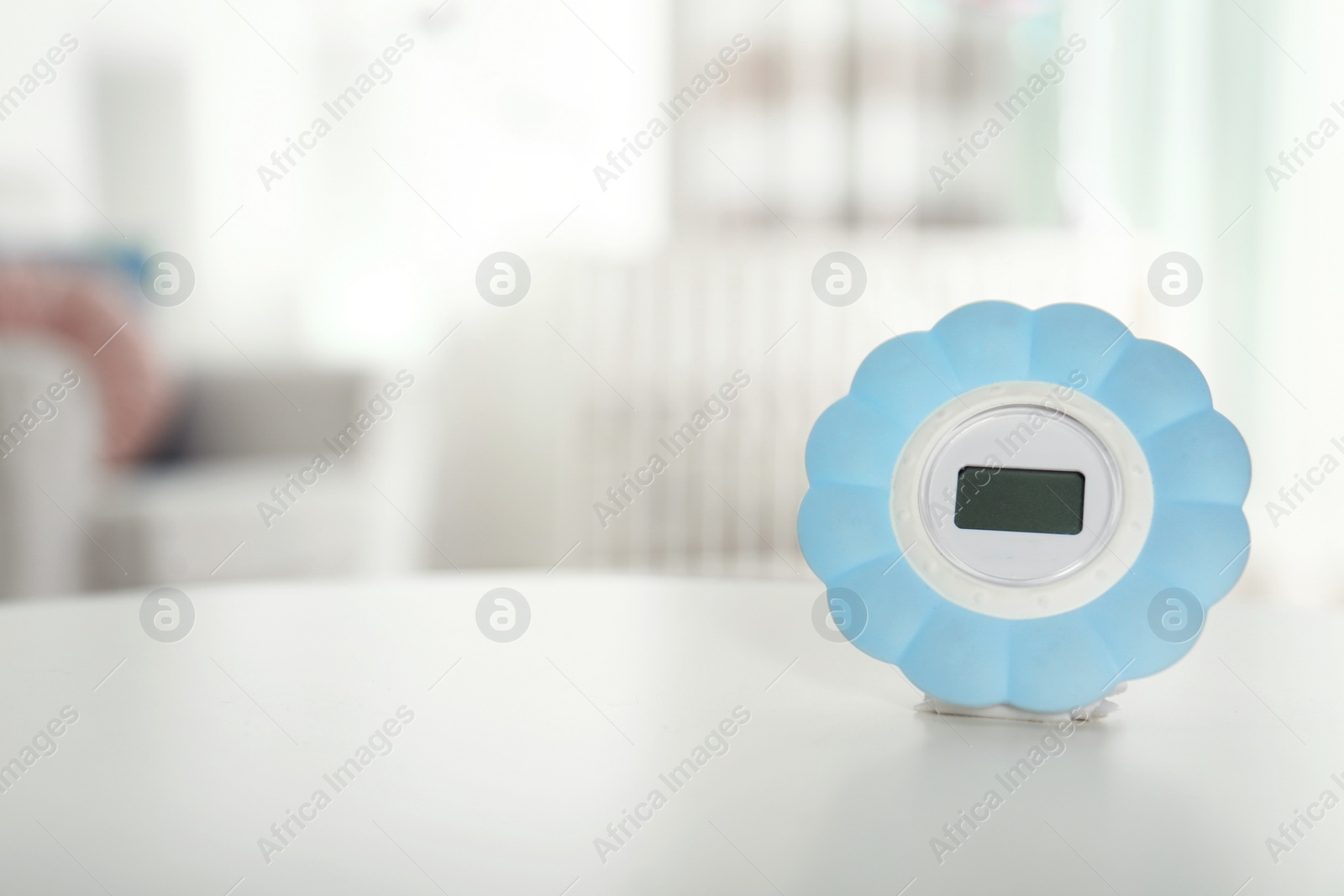 Photo of Digital temperature and humidity control in baby room interior. Space for text