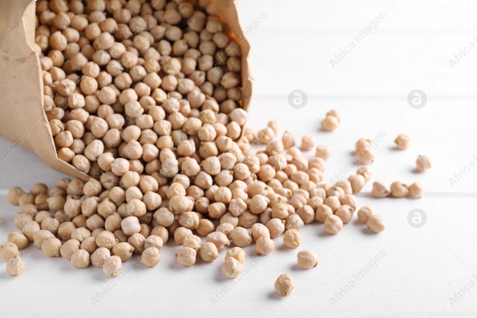 Photo of Chickpeas on white table, space for text