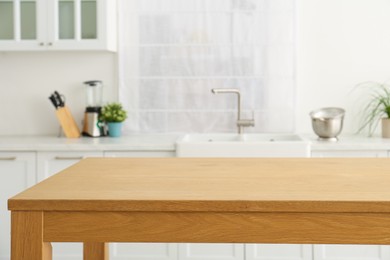 Stylish wooden table in kitchen. Interior design