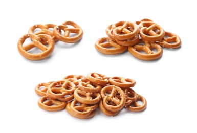 Set of tasty pretzel crackers on white background