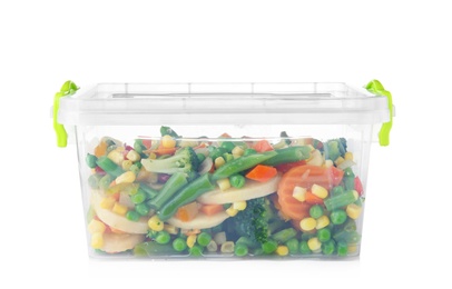 Plastic container with frozen vegetables on white background