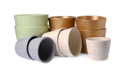 Photo of Many different empty ceramic flower pots on white background