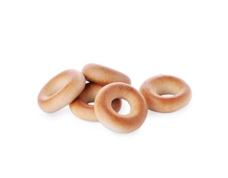 Tasty dry bagels (sushki) on white background