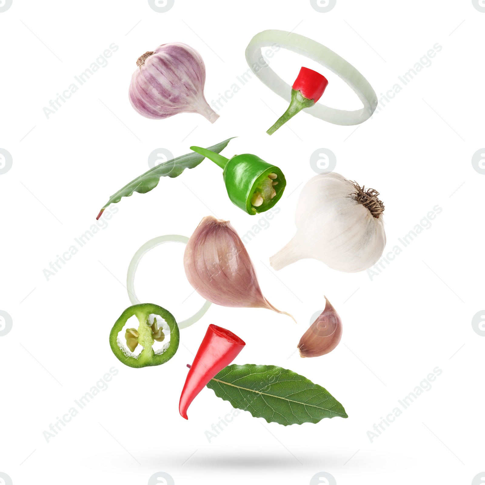 Image of Different aromatic spices falling on white background