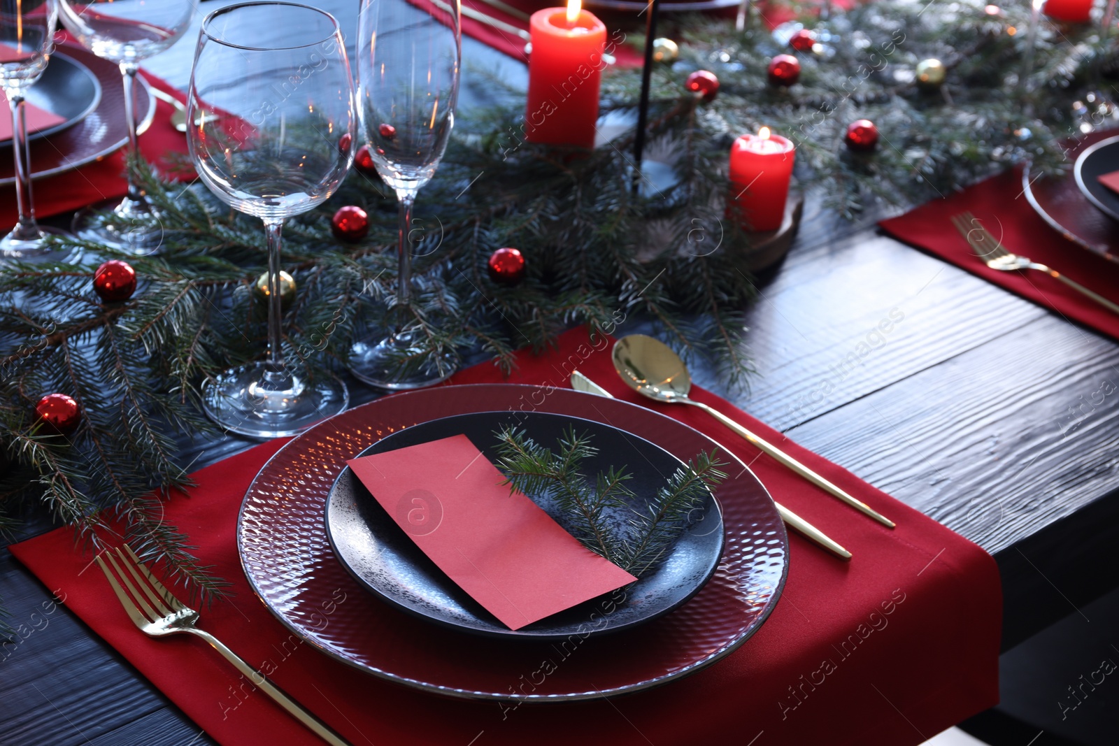 Photo of Elegant Christmas table setting with blank place card and festive decor