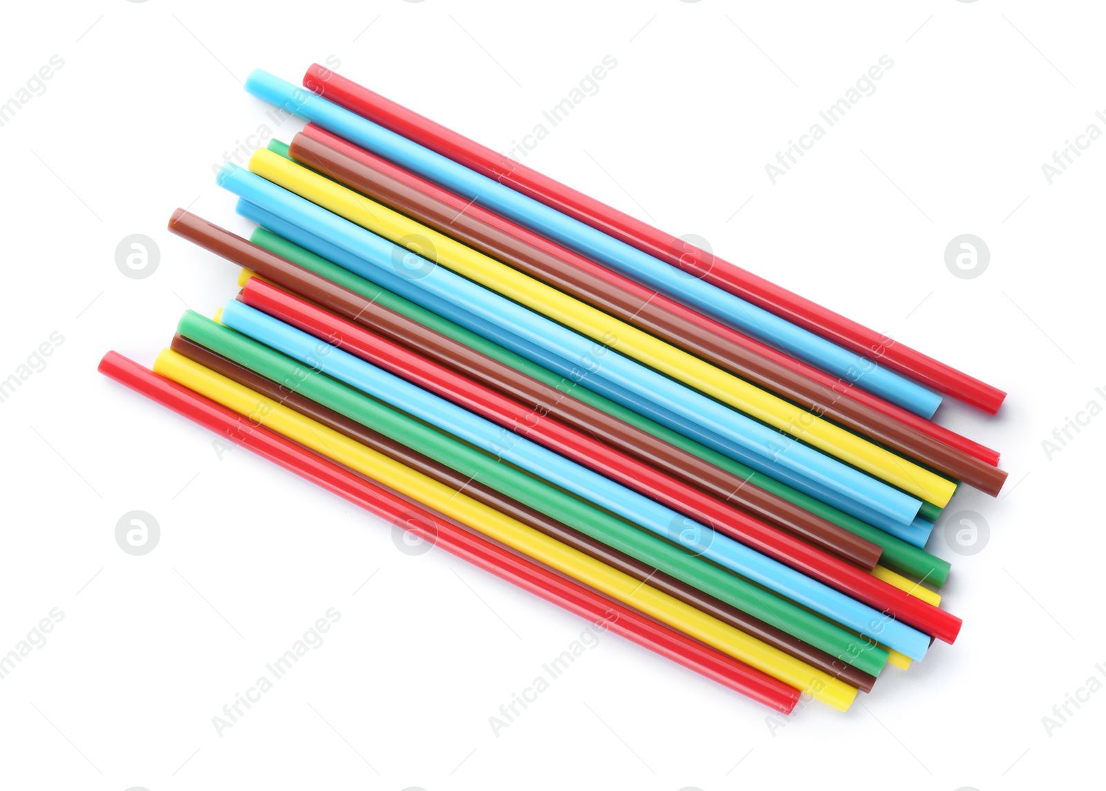Photo of Many colorful glue sticks on white background, top view