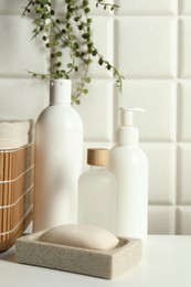 Photo of Bath accessories. Personal care products on white table