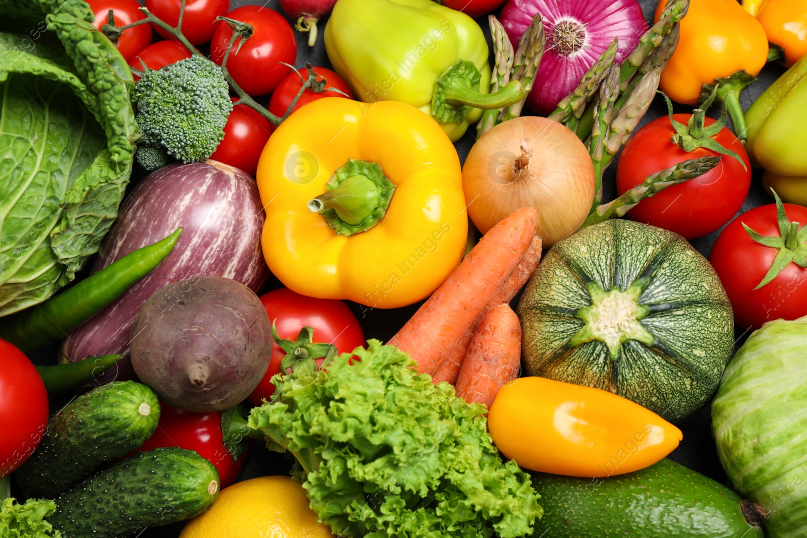 Photo of Different fresh vegetables as background, top view