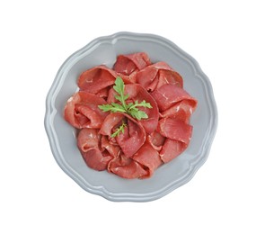 Slices of tasty fresh dry bresaola and arugula isolated on white, top view