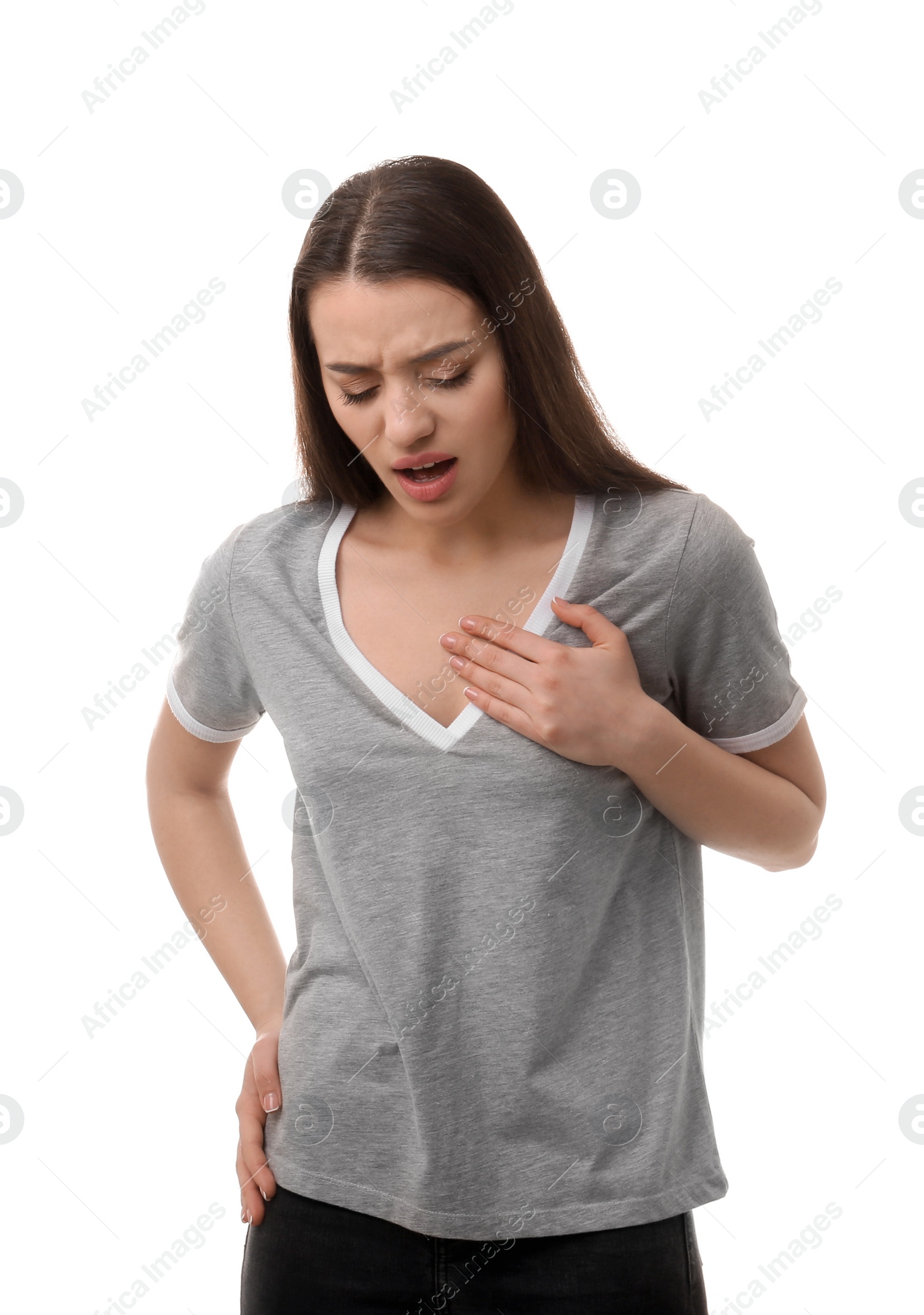 Photo of Young woman suffering from pain in chest on white background