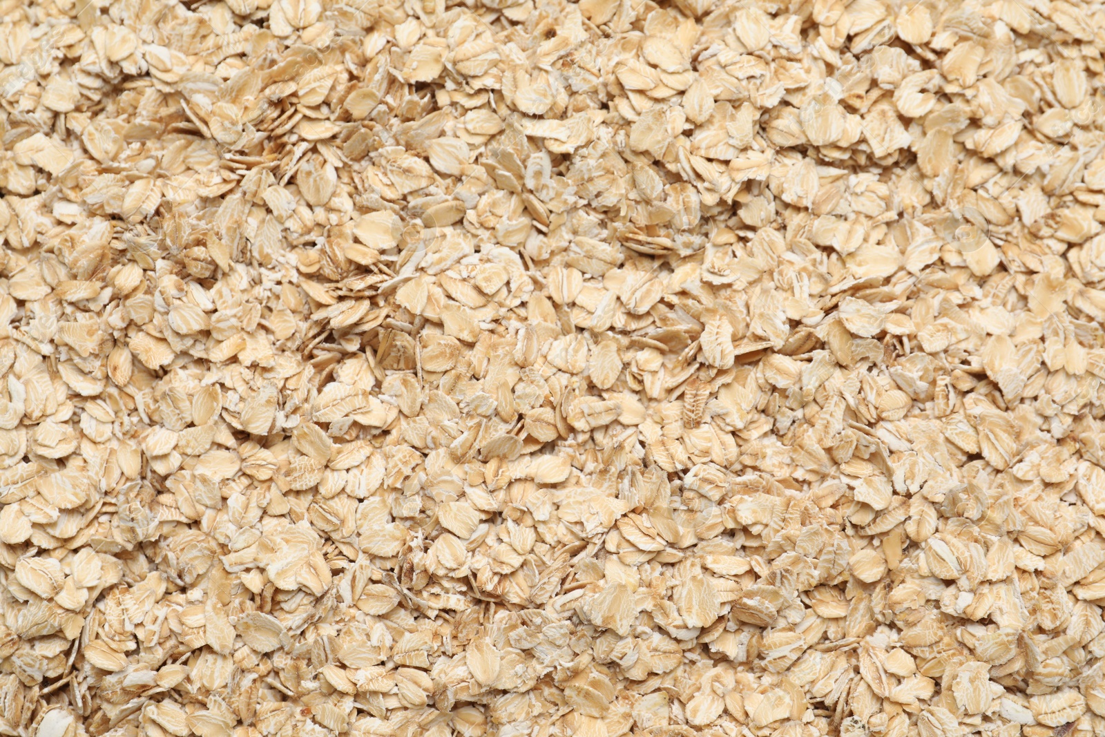 Photo of Top view of rolled oats as background