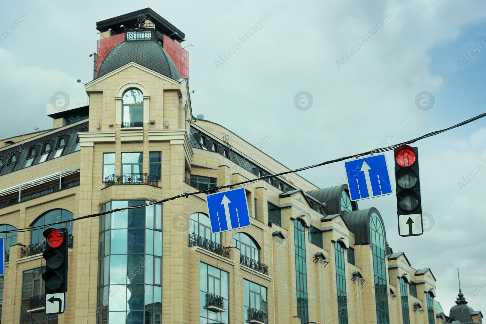 Photo of City street with traffic lights and road signs