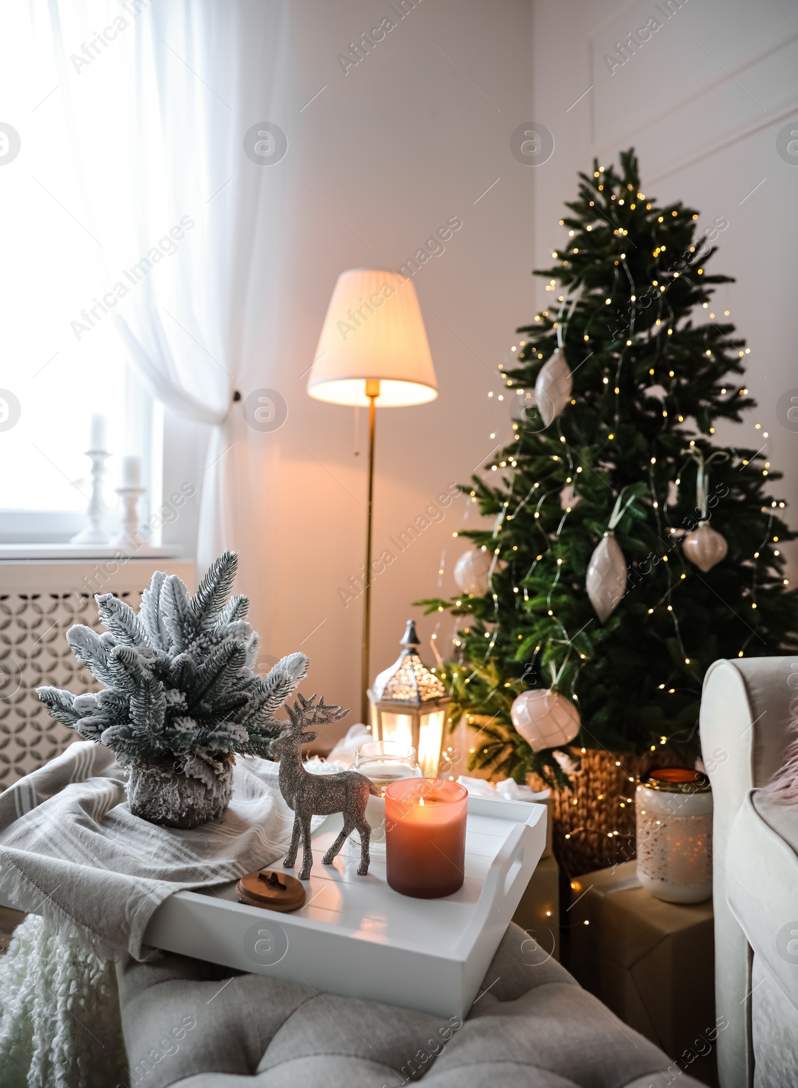 Photo of Beautiful Christmas tree in living room. Interior design