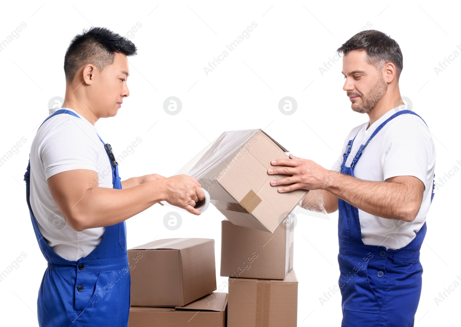 Photo of Workers wrapping box in stretch film on white background