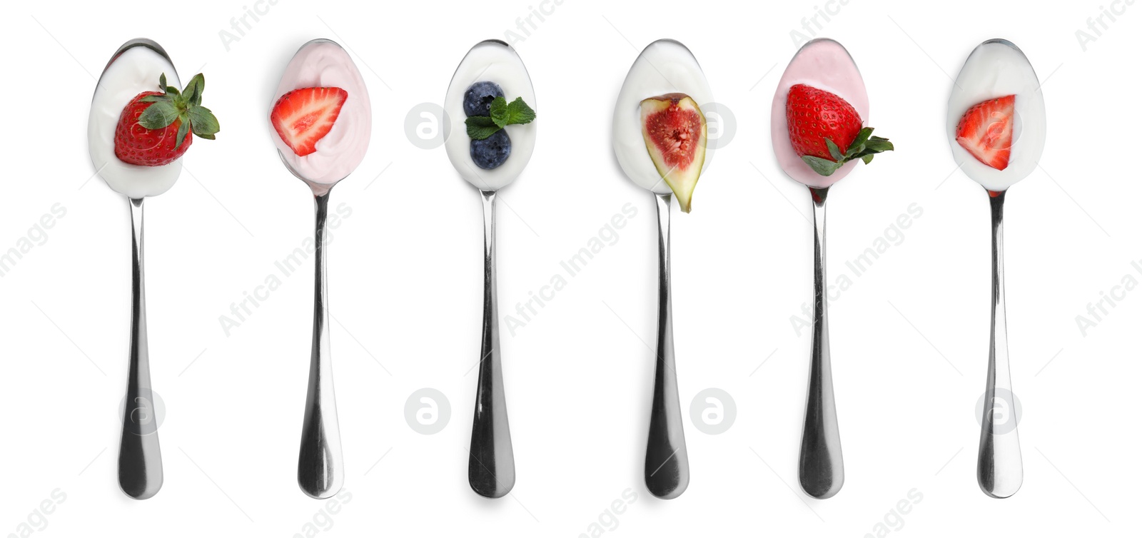 Image of Different delicious yogurts in spoons isolated on white, top view