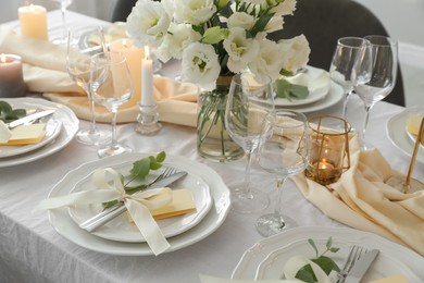 Photo of Festive table setting with beautiful floral decor