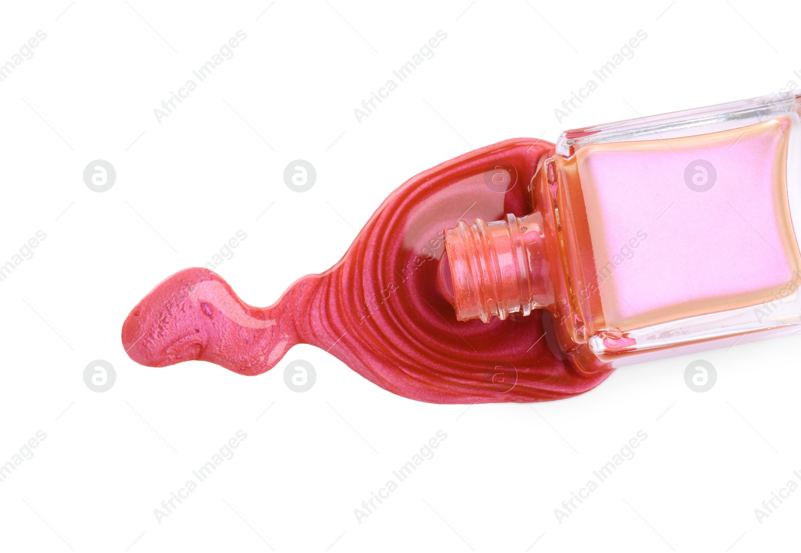 Photo of Overturned bottle of bright nail polish isolated on white, top view