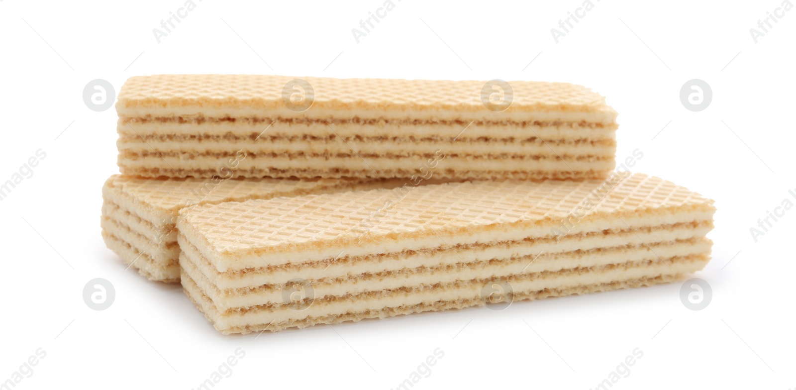 Photo of Delicious vanilla wafer sticks isolated on white