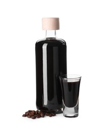 Glassware with coffee liqueur and beans isolated on white