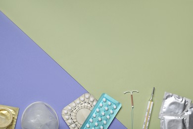 Photo of Contraceptive pills, condoms, intrauterine device and thermometer on color background, flat lay and space for text. Different birth control methods