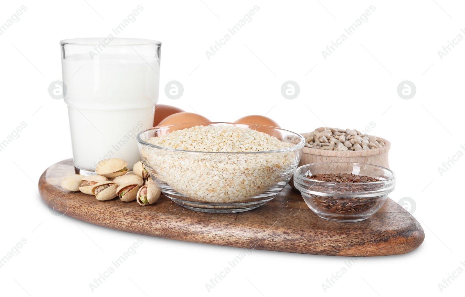 Photo of Board with different seeds, nuts and products high in healthy fats isolated on white