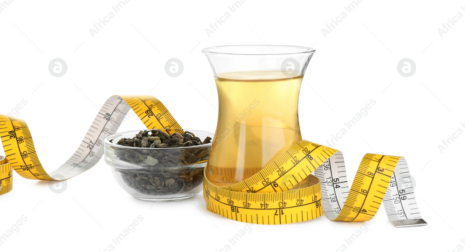 Photo of Diet herbal tea, dry leaves and measuring tape on white background