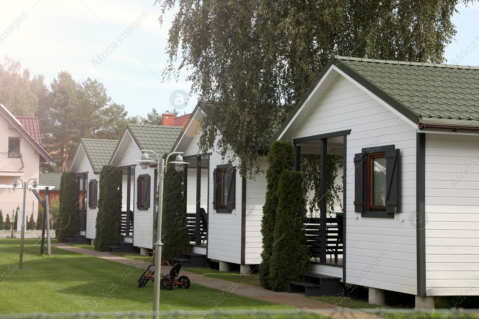 Photo of Exterior of beautiful modern white houses outdoors