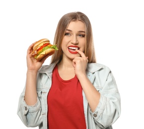 Pretty woman with tasty burger isolated on white