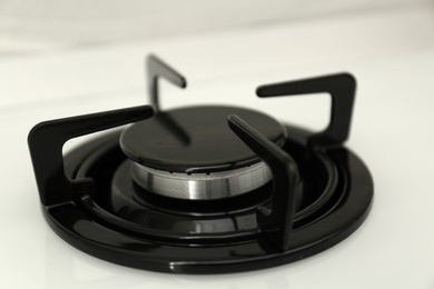 Photo of Modern built-in gas cooktop, closeup. Kitchen appliance