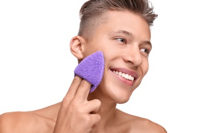 Photo of Happy young man washing his face with sponge on white background