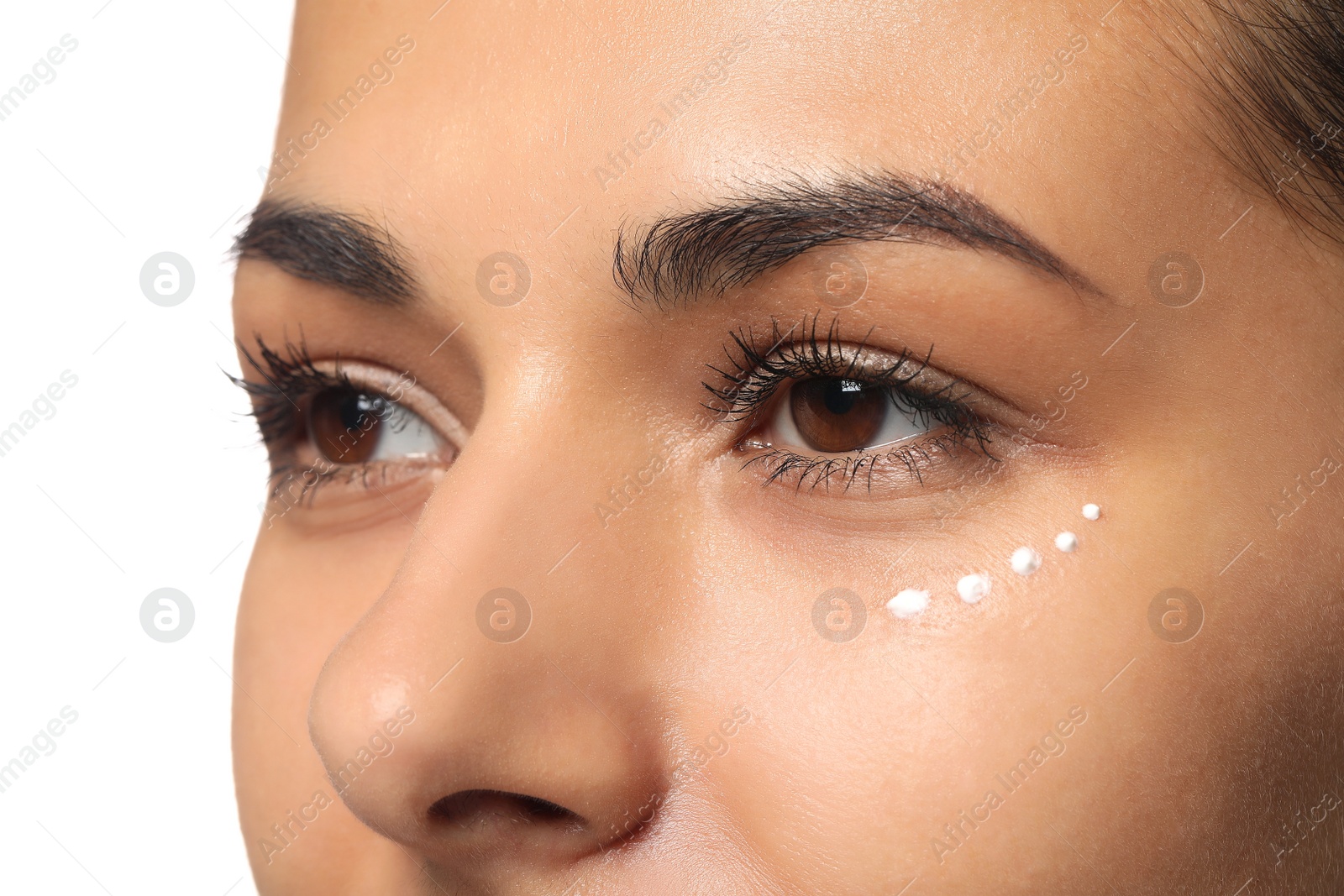 Photo of Woman with eye cream on white background, closeup. Skin care