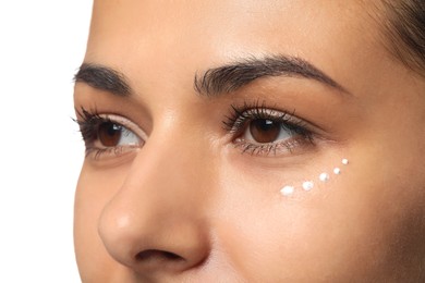 Photo of Woman with eye cream on white background, closeup. Skin care