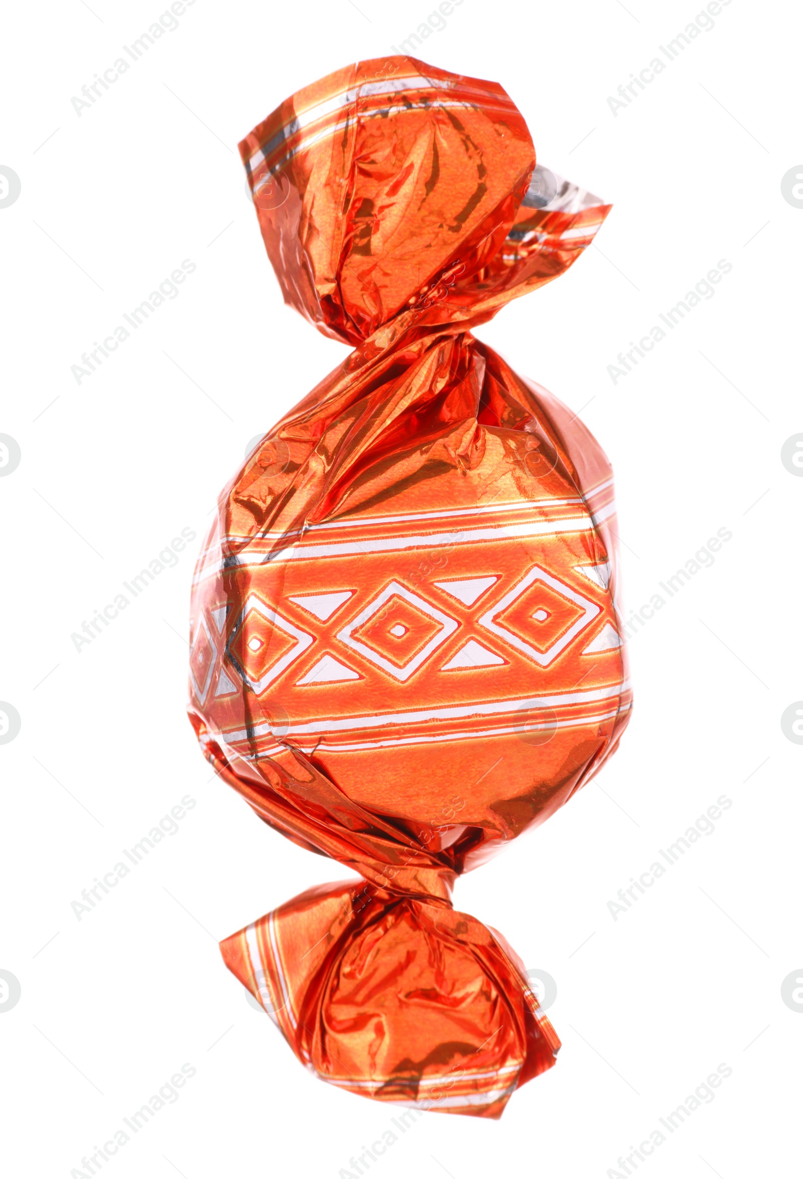 Photo of Candy in orange wrapper isolated on white