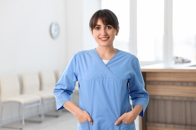 Portrait of smiling medical assistant in hospital