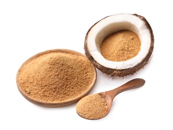 Photo of Coconut sugar in bowl, spoon and fruit isolated on white