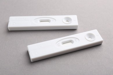 Photo of Disposable express tests on light grey background