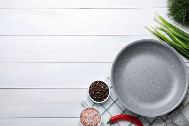 Photo of Flat lay composition with frying pan and fresh products on white wooden table, space for text