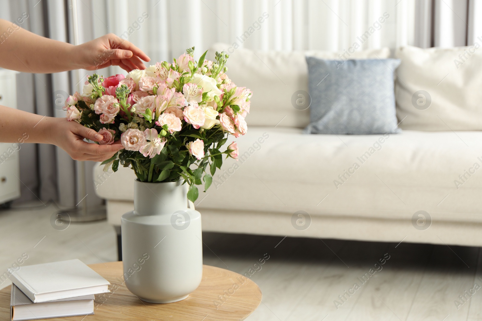 Photo of Woman with beautiful bouquet of fresh flowers at home, closeup. Space for text