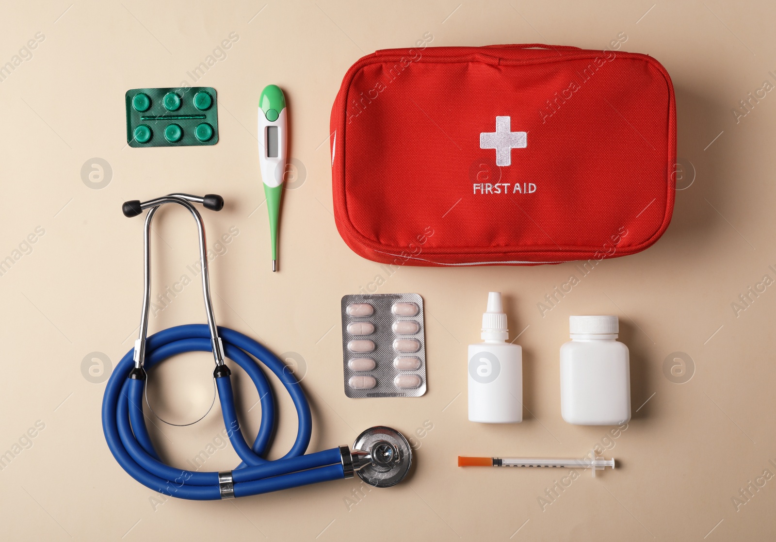 Photo of Flat lay composition with first aid kit on color background