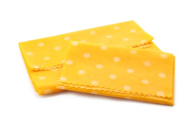 Photo of Reusable beeswax food wraps on white background