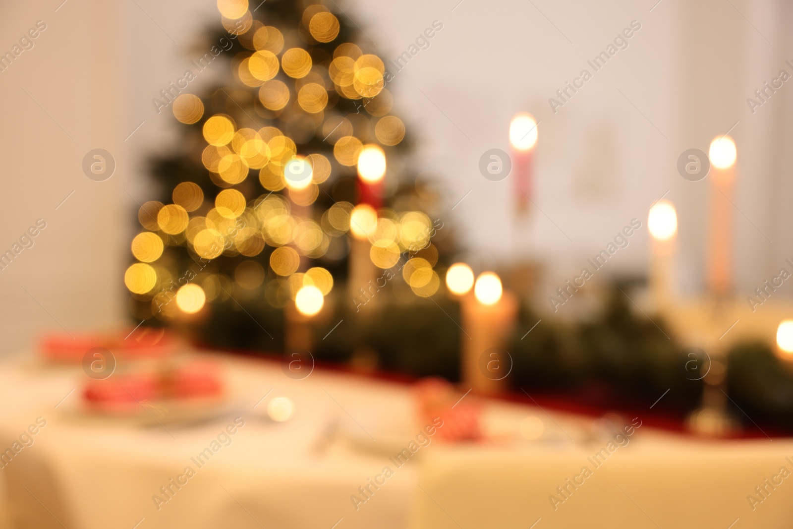 Photo of Blurred view of festive table setting and beautiful Christmas decor indoors. Interior design