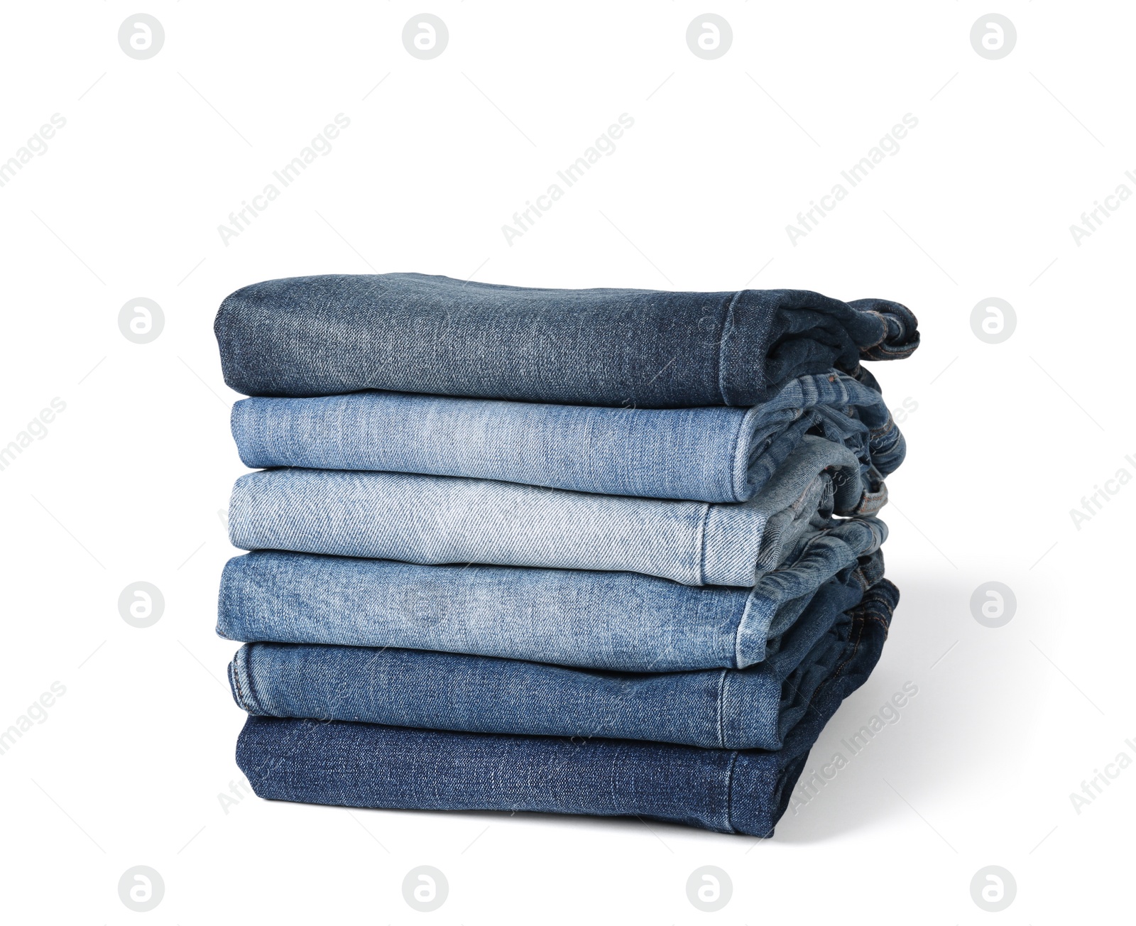 Image of Stack of different folded jeans isolated on white